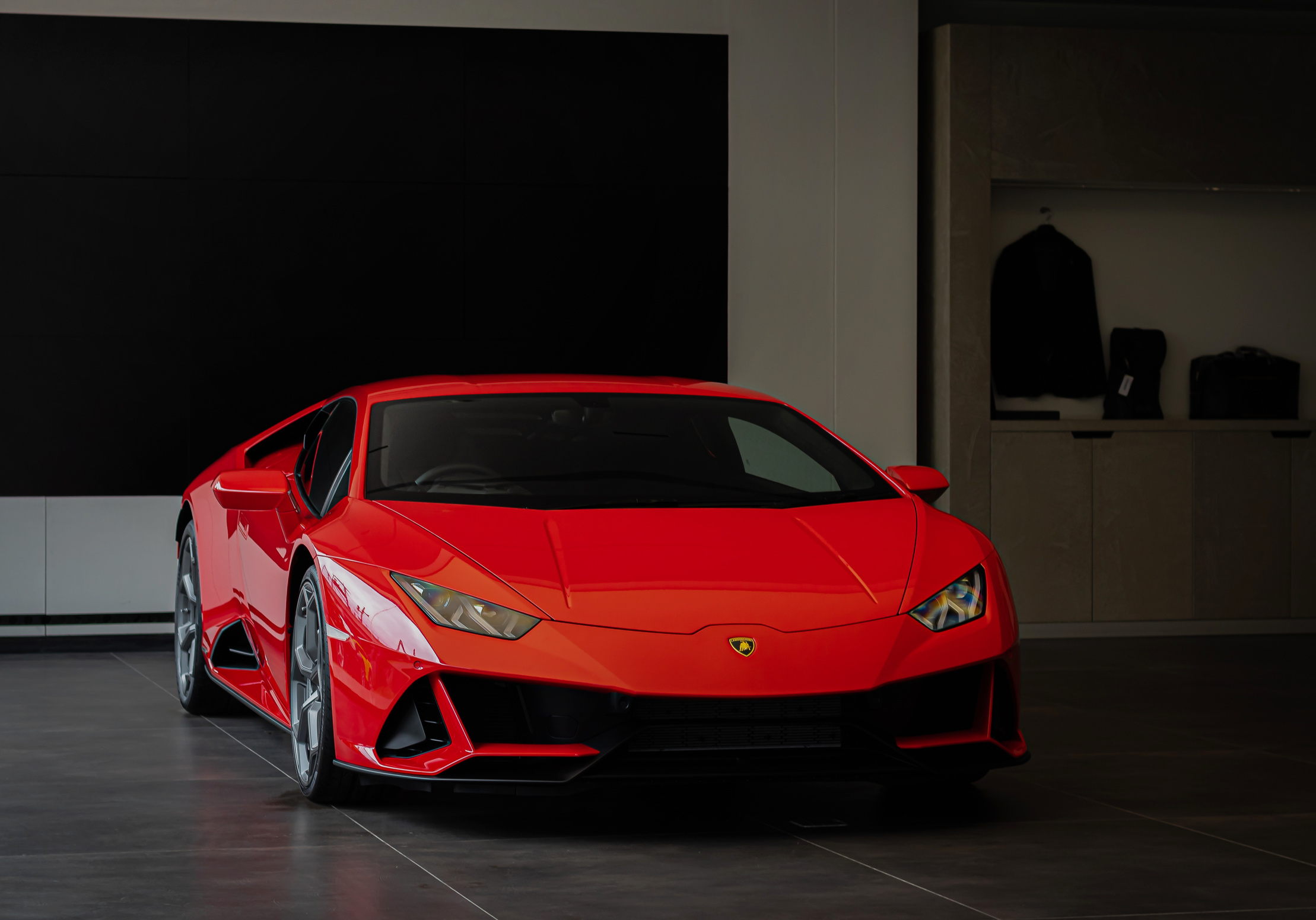 A Red Sports Car Parked inside the Garage
